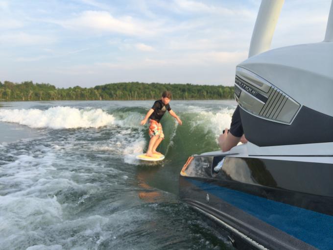 Wave with current set-up. 2 adults in the boat.